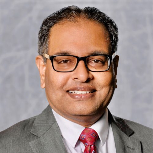 Shibu Jose smiling.